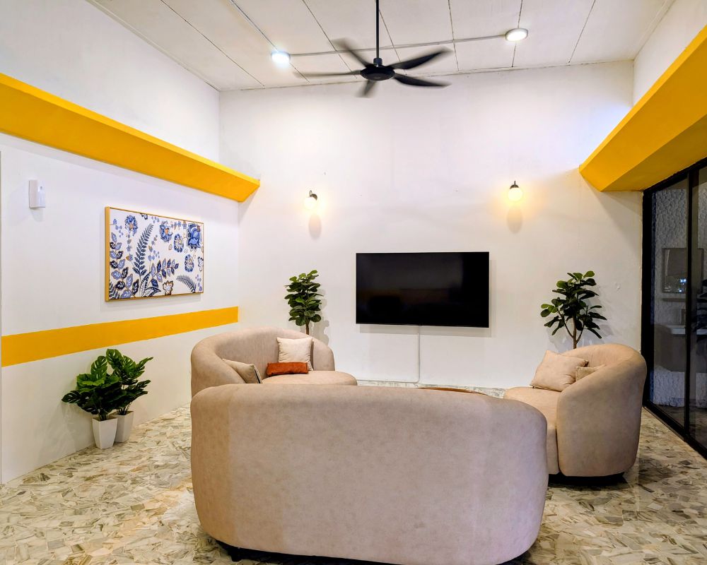 Family visiting a resident in a bright social space at Lumina Care