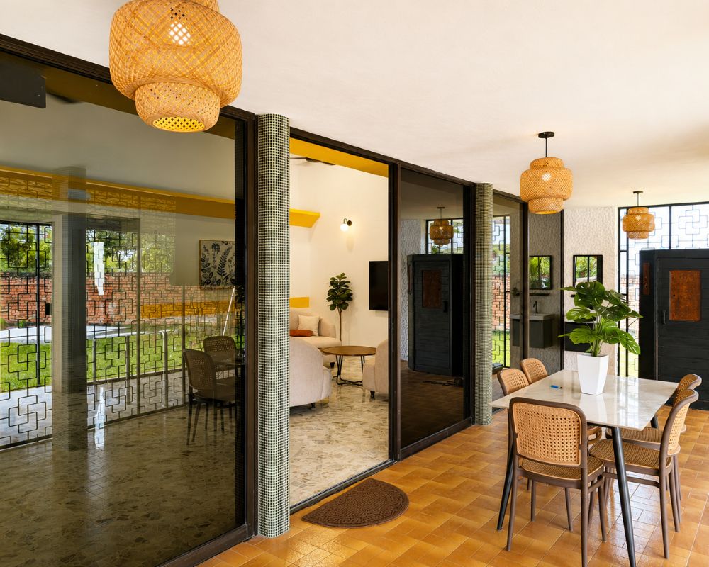 Family visiting a resident in a bright social space at Lumina Care
